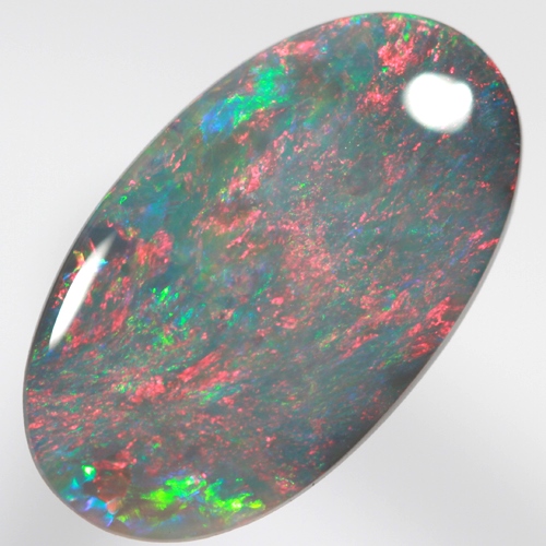 SOLID BLACK OPAL Bright red rolling flashes over green and blue sparkles SEE VIDEO